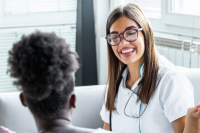 Nurse talking with young patient